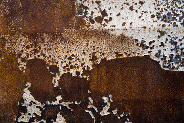The rust on the surface of the iron.