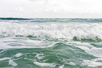 Naklejka na ściany i meble Blurred of waves while moving into the island.