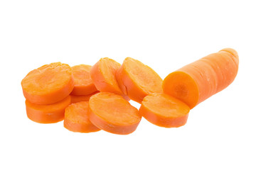 fresh carrots with slices of carrot on the white background
