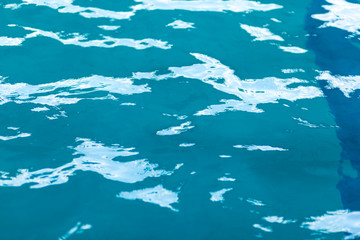 refreshing blue swimming pool water as a background.