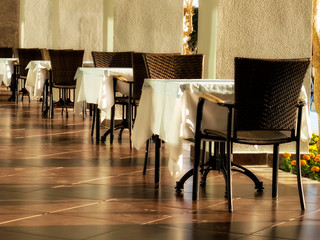 close up outdoor restaurant tables and chairs