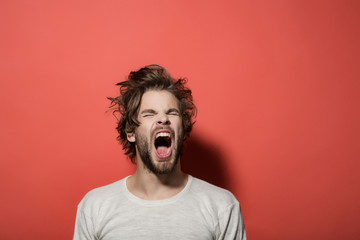 shouting or yawning man with long uncombed hair, morning, headache