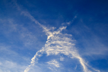 Fototapeta na wymiar X cross cloud from Aircraft Trails on blue sky background,Thailand