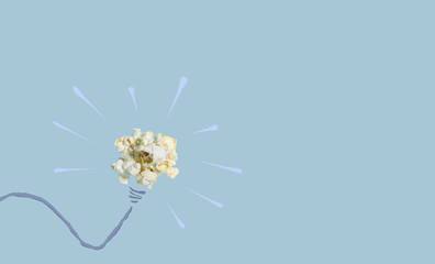 Thinking good idea pop up like a popcorn pop up with blue background, creative concept have a new idea. popcorn object include with path file.