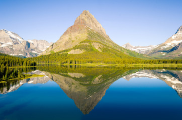 Early Morning Reflection on Swiftcurrent Lake in Glacier National Park, Montana.