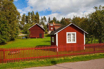 Fototapeta na wymiar Typical scandinavian wooden houses in village. Dalarna county, Sweden.