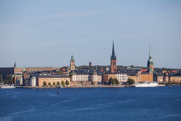 Obraz premium Scenic summer aerial view of old town, city hall and central embankments with boats. Stockholm, Sweden