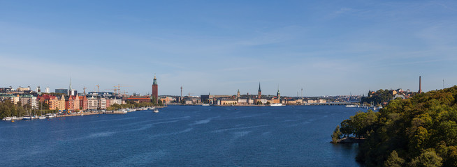 Scenic summer aerial view of old town, city hall and central embankments with boats. Stockholm, Sweden