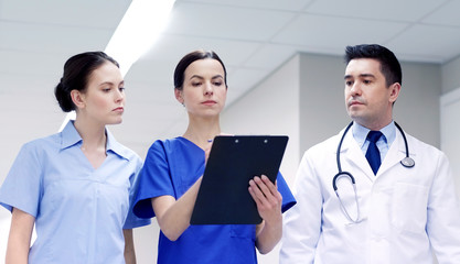 group of medics at hospital with clipboard