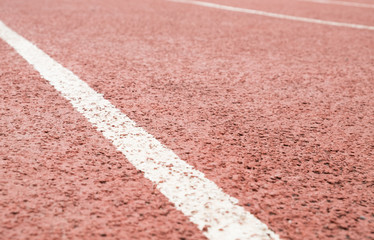 surface of the red running track in the stadium on top view for copy space emtry background.