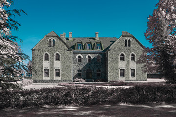 Old stoned building in Cesis, Latvia. Infrared photography, color swapped process.