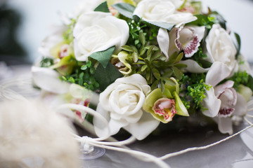 Tender bouquet of white roses and greenery