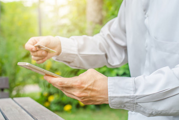 Online payment,Man's hands holding a credit card and using smart phone for online shopping