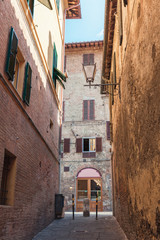 Fototapeta na wymiar A narrow street in Siena, Italy