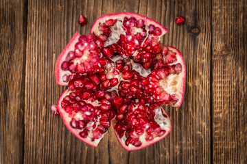Wooden table with Pomegranate (selective focus)
