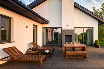 Patio with wooden furniture