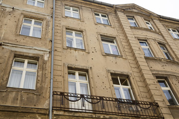 Building with bullet holes of war