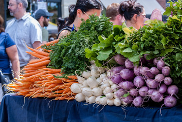 Carros, turnups, onions and salad greens for sale at local farmers market