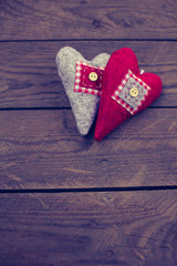 Heart from a fabric on a background of the old board