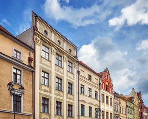 Facades of old tenement houses in Torun old town, Poland.