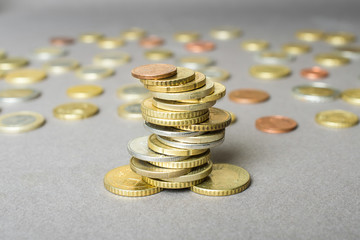Coins stacked on each other in different positions. Money concept.