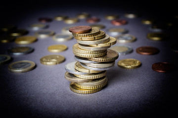 Coins stacked on each other in different positions. Money concept.
