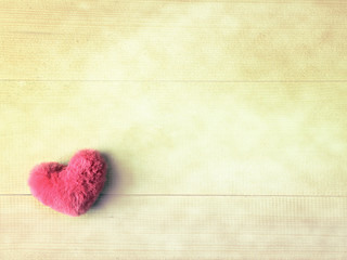 Pink fluffy heart on wood vintage background for love valentines background