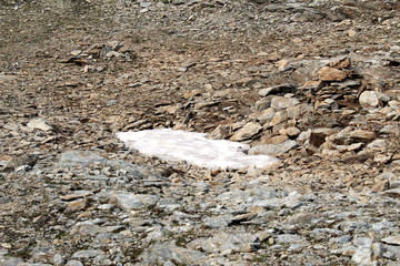 Melting snow between rocks