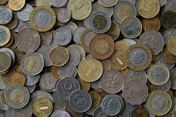 A pile of coins from different countries