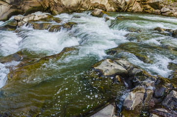 background landscape with waterfall in Yaremche vilage in Ukraine