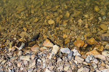 Stones and water at Albufeira da Barragem de Campilhas lake