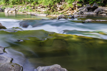 background landscape with waterfall in Yaremche vilage in Ukraine