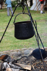 Metal medieval pot for cooking on fire