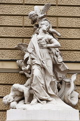 Fototapeta na wymiar Sculpture on house of opera theater in Odessa, Ukraine.