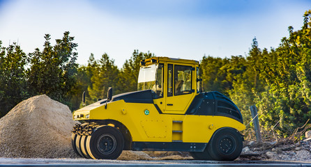 Fototapeta premium Heavy Vibration roller at asphalt pavement works Asphalt paver road repair