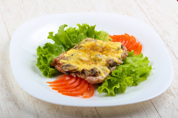 Pork steak with mushroom and cheese