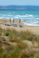 Beach seascape with umbrellas, chairs and beds. Seascape of Termoli, Molise, in Italy. windy day...