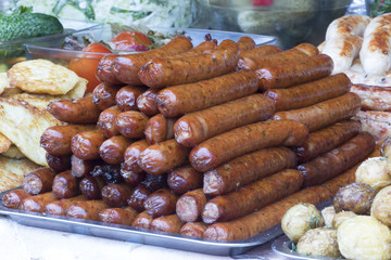 Traditional food. Smoked sausages meat hanging in domestic smokehouse