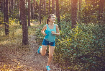 Woman running in the forest