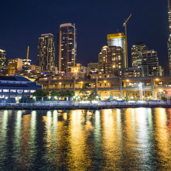 Plakat Cityscape at night on water skyline city