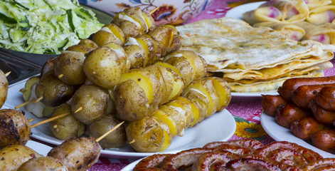 Grilled vegetables and chicken on wooden table overhead shot