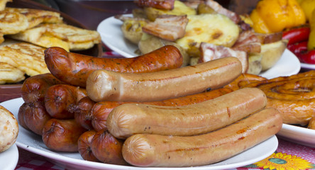 Traditional food. Smoked sausages meat hanging in domestic smokehouse