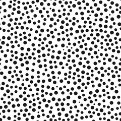 Chaotically scattered small round spots. Seamless pattern.