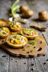 Potato boats filled with corn, ham, cheese and green onion