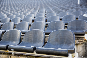 Fototapeta premium Empty tribune with black seat on soccer sdadion