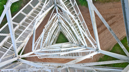 View from above through a metal lattice from the tower