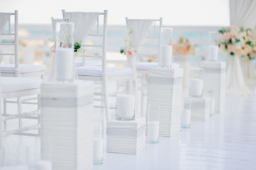 luxury wedding decorations with gentle rose and white tones, number of white wedding chairs, background
