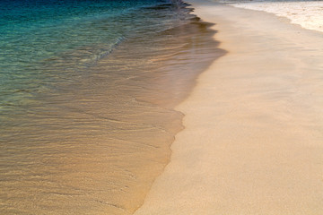 Azure water and yellow sand