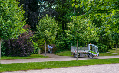 Gardeners or workman cleaning a public park