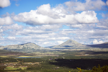 Fototapeta premium Mountains in cloudy Rondane national park, Norway